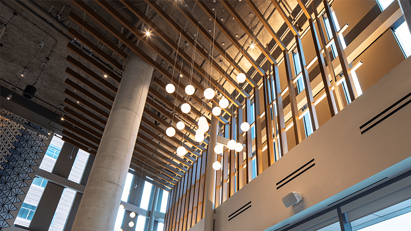 Pure + FreeForm Aluminum Woodgrain ceiling baffles in AHSB Cafe