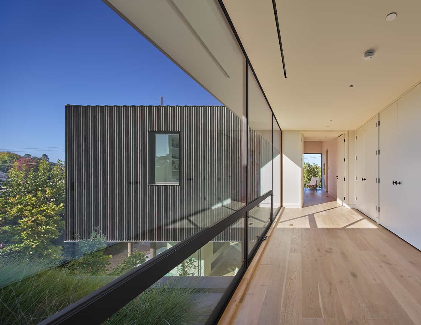 Sculptural shark fin panel in Deco Bronze 2 by Pure + FreeForm on a luxury residence, highlighting modern elegance and architectural sophistication.