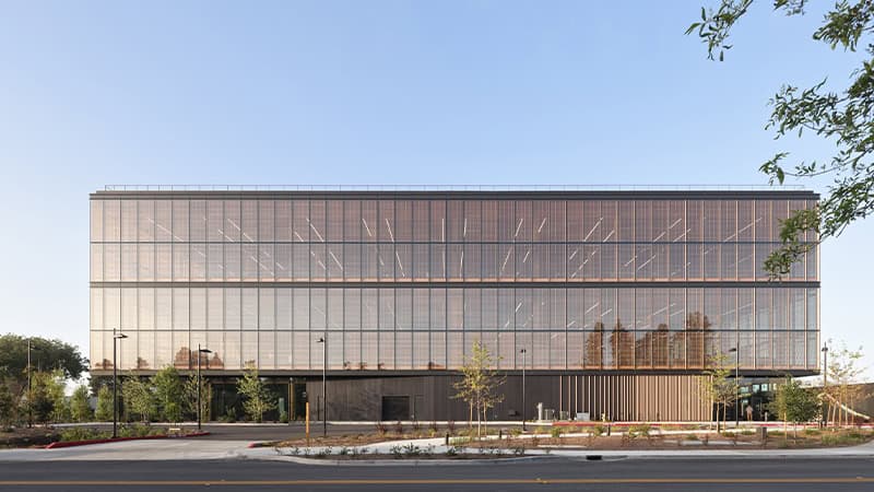 Google Borregas building exterior featuring a custom blackened steel finish with box rib formed panels by Pure + FreeForm on the exterior wall, creating a sleek, modern look.