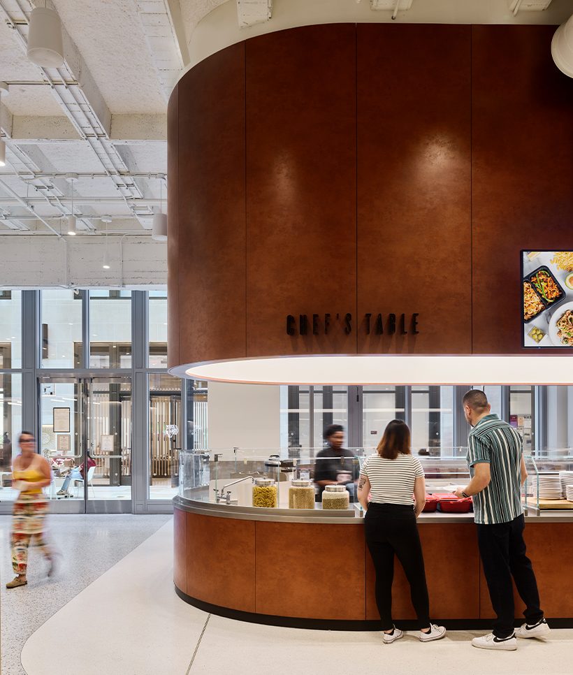 Millwork at Fordham University Marketplace featuring Pure + FreeForm's Prismatic Spritz rust finish, adding texture and warmth to the modern architectural design.