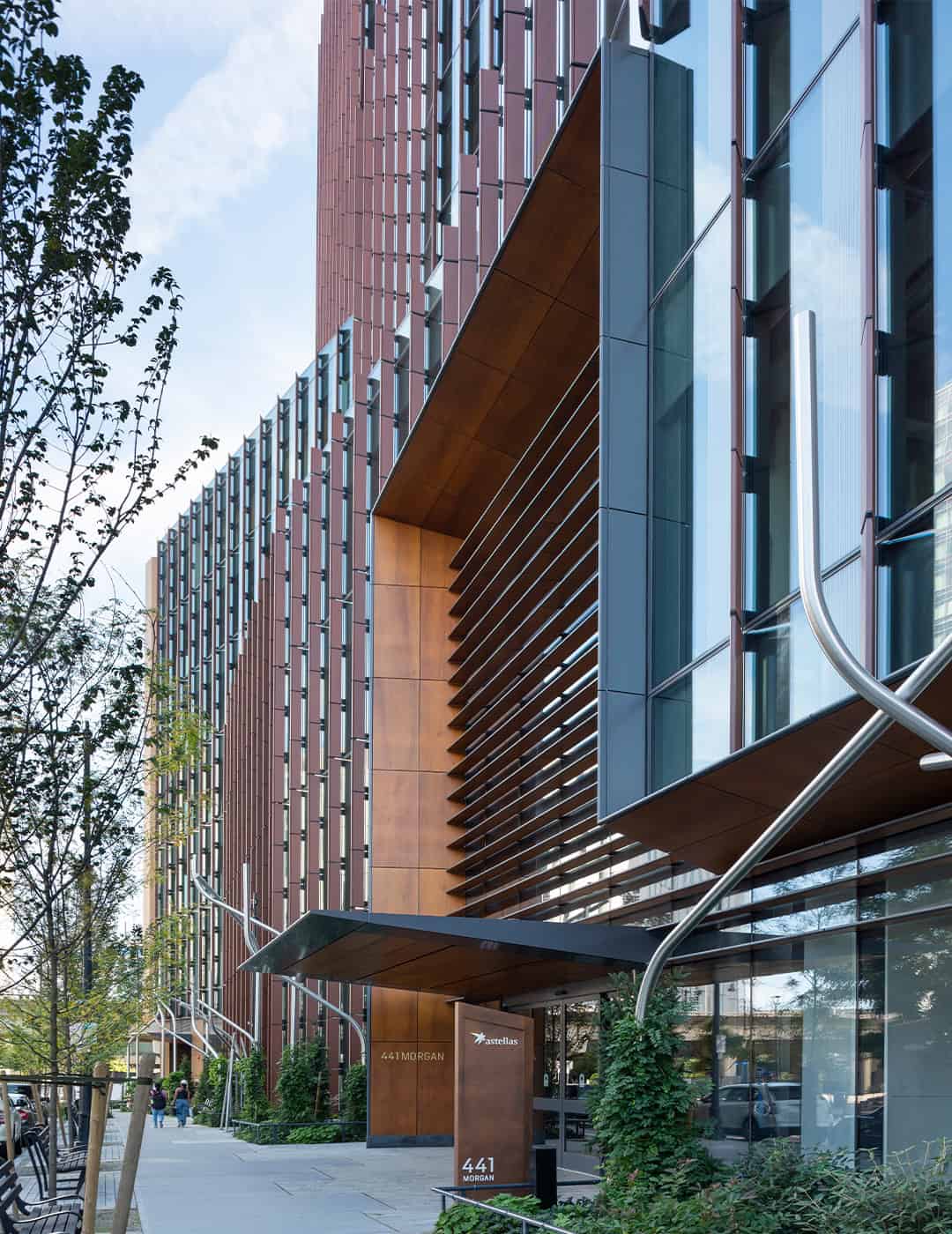 The Parcel U building’s exterior showcasing a custom corten steel finish by Pure + FreeForm, with a distinctive rusted patina that complements its modern design.