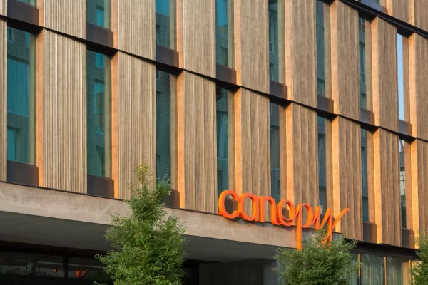 CanopyByHilton_ExteriorWalls_CorrugatedPanels_Bronze4 Decorative corrugated metal wall panels on modern architectural façade.