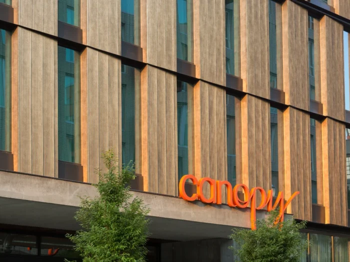 Decorative corrugated metal wall panels on modern architectural façade.