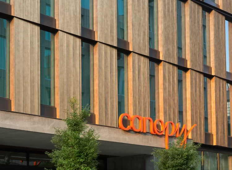 CanopyByHilton_ExteriorWalls_CorrugatedPanels_Bronze4 Decorative corrugated metal wall panels on modern architectural façade.