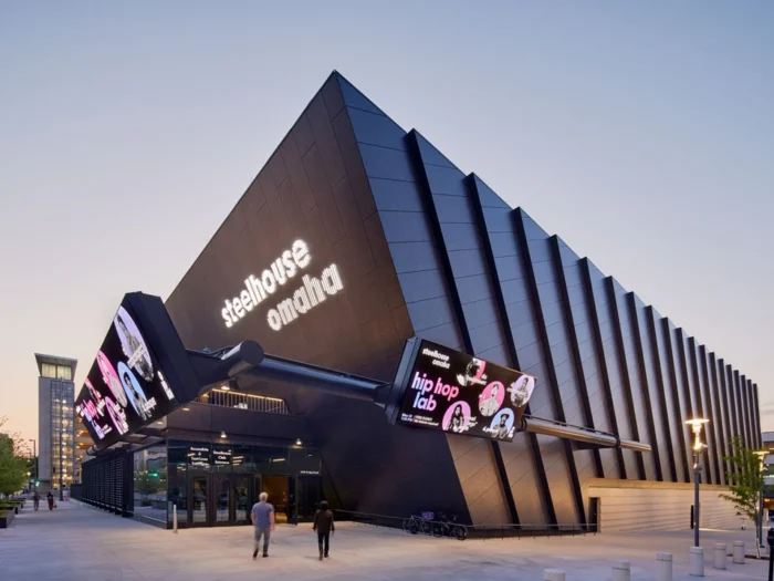 OmahaPerformingArts_ExteriorWalls_BlackenedSteel6 Modern architectural metal walls with textured metal panels on exterior façade